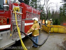 The additional suction line on the driver's side allowed the 1000 gpm pumper to improve its output. The operator of the pumper was already drafting from the officer side suction inlet prior to the auxiliary intake being brought on line.